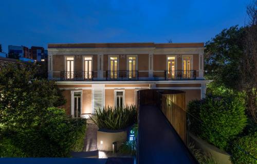 a large white house with lights on at Hacienda Peña Pobre in Mexico City