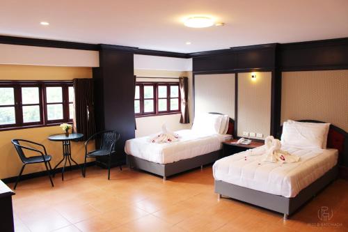 Postel nebo postele na pokoji v ubytování Rest@Ratchada hotel