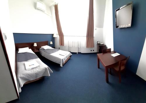 Кровать или кровати в номере OSiR Polna