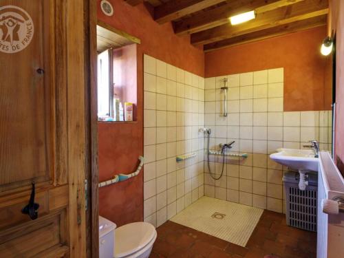 a bathroom with a shower and a toilet and a sink at Gîte Saint-Martin-la-Sauveté, 6 pièces, 10 personnes - FR-1-496-128 in Saint-Martin-la-Sauveté
