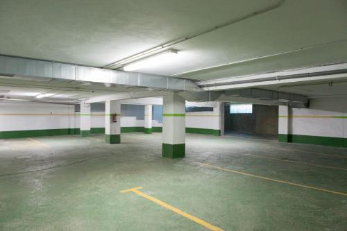 an empty parking lot in an empty parking garage at Hotel Valencia in Ferrol