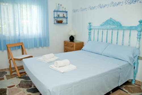 Un pat sau paturi într-o cameră la Sargantana Blava