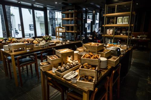 a long table with many boxes of food on it at InterContinental Perth City Centre by IHG in Perth