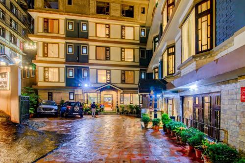 an empty street in an apartment building at night at Muscatel Grand Silkroute - 300 Mts from MG Marg in Gangtok