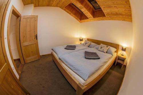 Säng eller sängar i ett rum på Chalet Zuberec
