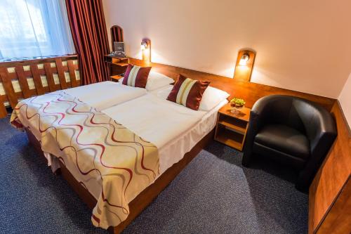 Postel nebo postele na pokoji v ubytování Hotel Sachticka