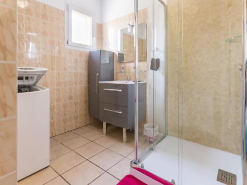 a bathroom with a sink and a shower at Gîte Saint-Viaud, 3 pièces, 4 personnes - FR-1-306-1190 in Saint-Viaud