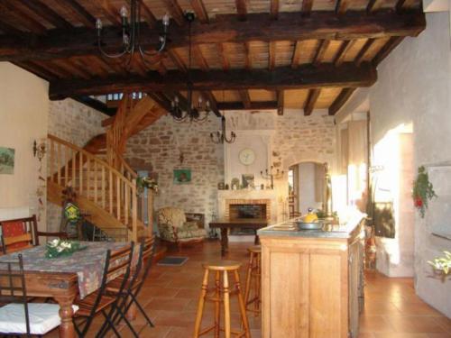 a kitchen and dining room with a table and a dining room at Maison de Caractère 14ème Siècle, 6 Pers., Grand Jardin & Cheminée, Près de Nancy et Verdun - FR-1-585-46 in Void