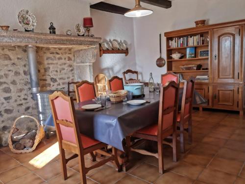 a dining room with a table and chairs at Gîte Mazeyrat-d'Allier, 4 pièces, 5 personnes - FR-1-582-200 in Mazeyrat-d'Allier