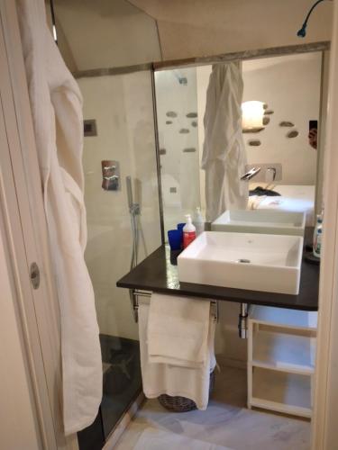 a bathroom with a sink and a mirror at Casa Roberta in Dolceacqua