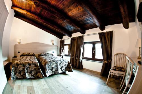 a bedroom with a bed in a room at Agriturismo Cascina del Vai in Cairo Montenotte