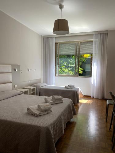 Postel nebo postele na pokoji v ubytování Hotel Due Giardini