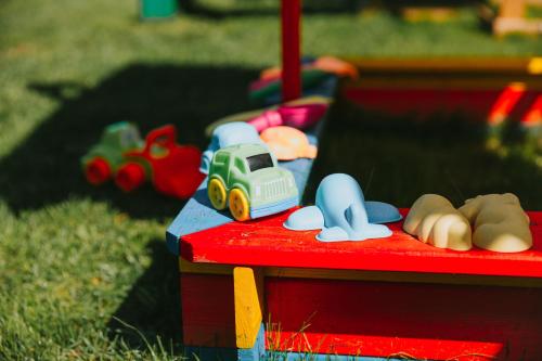 a toy truck sitting on top of a red table at Guest House Lorem in Daugavpils