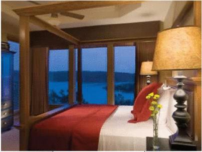 a bedroom with a bed with a view of the ocean at Hilton Grand Vacations Club Long Creek Ridgedale in Ridgedale