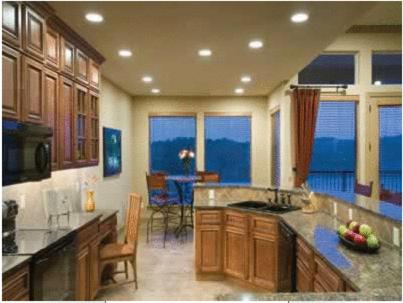 a kitchen with a counter and a table with chairs at Hilton Grand Vacations Club Long Creek Ridgedale in Ridgedale