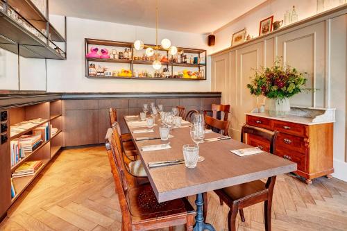 a dining room with a long table and chairs at Hotel Restaurant Seehof in Küssnacht