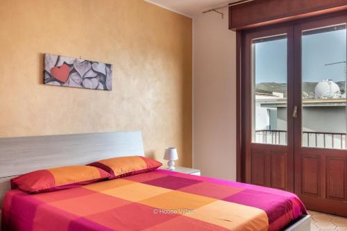A bed or beds in a room at House&Villas - Mare Blu