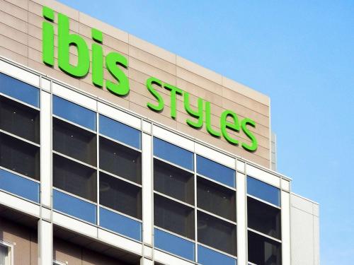 a building with a ups sign on top of it at ibis Styles Osaka Namba in Osaka