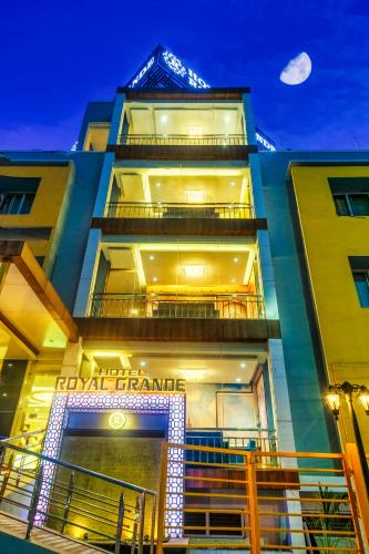 a tall building with a sign on it at HOTEL ROYAL GRANDE in Vellore
