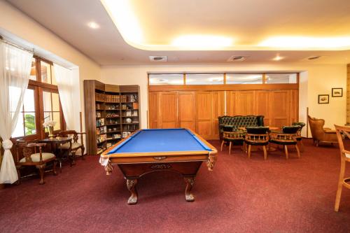 a pool table in the middle of a room at ROMANTIK HOTEL ELEONORA in Tábor