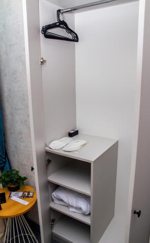 a closet with a desk with towels in it at Готель Art Gallery in Odesa