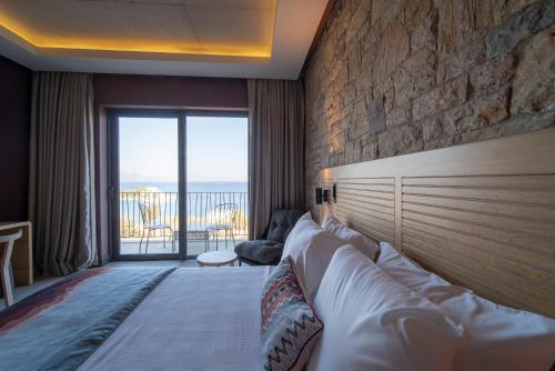 Ένα ή περισσότερα κρεβάτια σε δωμάτιο στο Cape Krio Boutique Hotel & SPA - Over 9 years old Adult Only