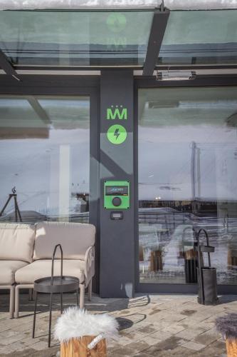 a store window with a couch and chairs in it at Hotel Lyskamm in Breuil-Cervinia