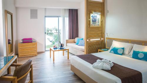 Postel nebo postele na pokoji v ubytování Baia di Conte Resort