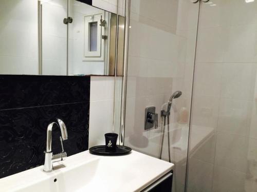 a bathroom with a sink and a shower at Regency Residence with Pool - Next the Beach in Herzliya