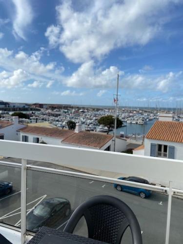 a view of a city from a balcony at Hotel Bord A Bord in Noirmoutier-en-l'lle