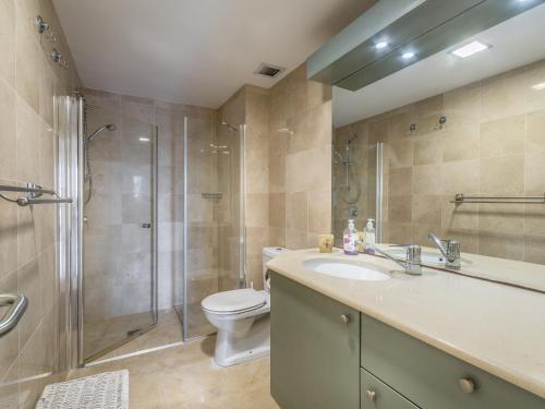 a bathroom with a sink and a shower and a toilet at Front of Beach next Ritz Hotel - 3 Bedroom& 3 Bathroom in Herzliya