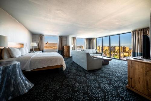 a hotel room with a bed and a large window at Holiday Inn Resort South Padre Island-Beach Front, an IHG Hotel in South Padre Island