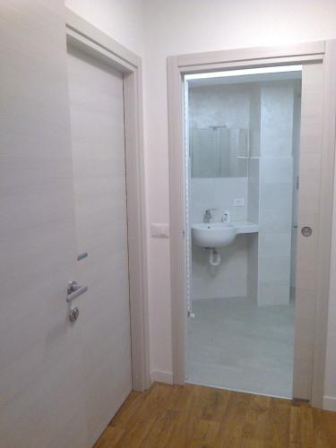 a bathroom with a sink and a mirror at B&B The Secret Place in Cavedago