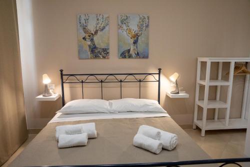Postel nebo postele na pokoji v ubytování b&b Zio Luciano