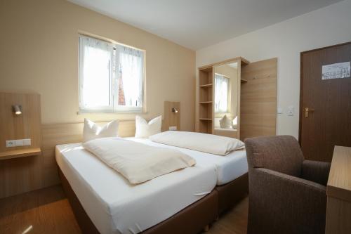 Postel nebo postele na pokoji v ubytování Hotel-Restaurant Stern