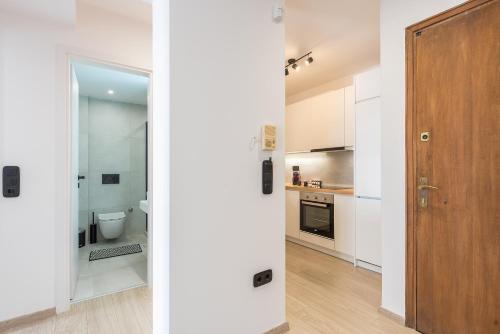 A kitchen or kitchenette at Petraki Residence 1bdr Apt with balcony 1 min from Ermou str