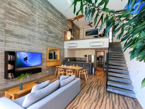 a living room with a couch and a table at Nereidas Lofts in Bucerías
