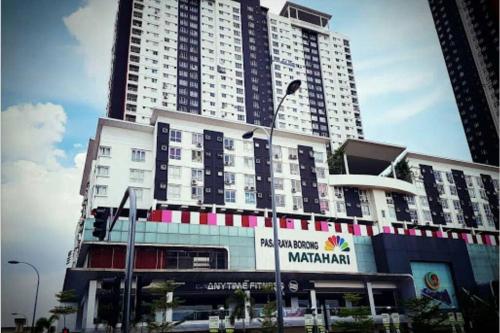 a large building with a sign in front of it at Cozy designer loft near KL city center in Ampang