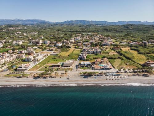 an aerial view of a resort on the beach at Aegean Breeze Luxury Apartments next to the sea in Maleme