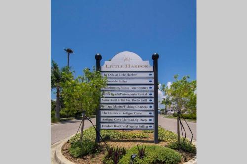 a sign for the entrance to the entrance library at Little Harbor Resort #306 Tampa Bay FL Beach, Bayside, 2 Pools in Ruskin