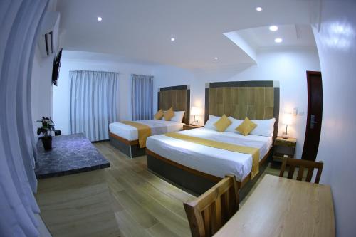 Postel nebo postele na pokoji v ubytování Hotel Vicentina