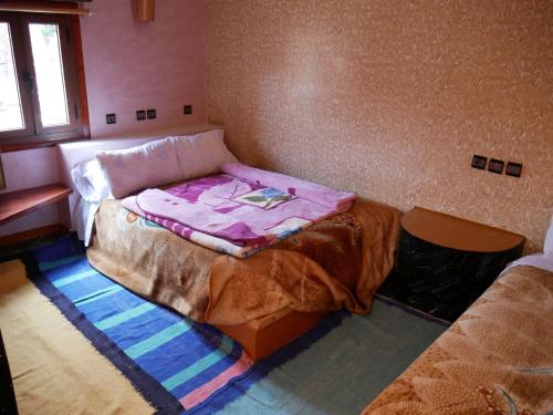 Una cama o camas en una habitación de Hotel Baddou