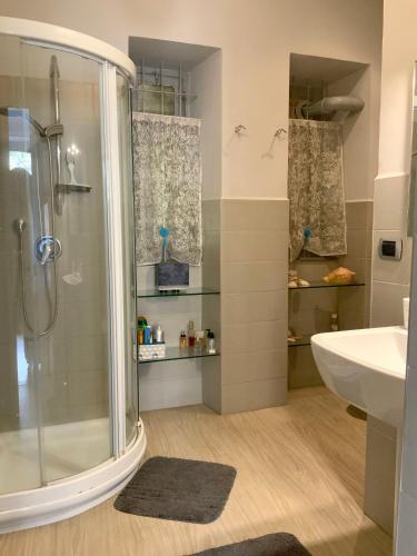 a bathroom with a shower and a sink at Casa Dante in Turin