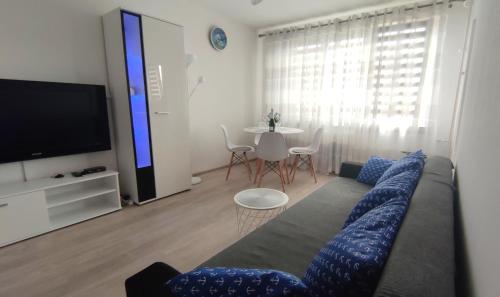 Televízia a/alebo spoločenská miestnosť v ubytovaní Apartament Sunwave Władysławowo