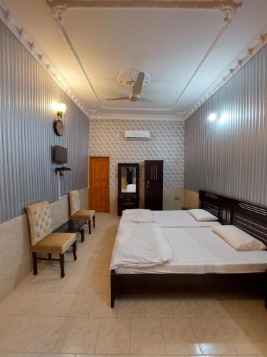 Ένα ή περισσότερα κρεβάτια σε δωμάτιο στο Taj Mahal Guest House