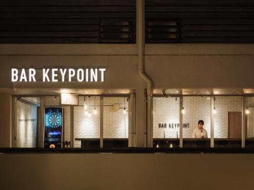a bar key point sign on a building at night at SHIRAHAMA KEY TERRACE SEAMORE RESIDENCE - Vacation STAY 35166v in Kanayama