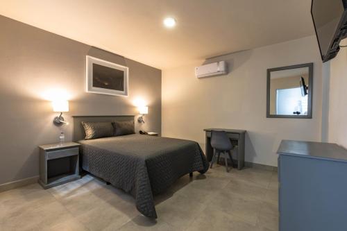 Postel nebo postele na pokoji v ubytování Hotel Nuve Gomez Palacio