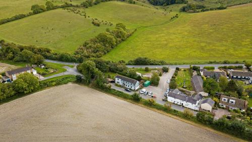 an aerial view of a village with houses and a road at Aspen, Country Chalet located In Pegsdon in Hexton