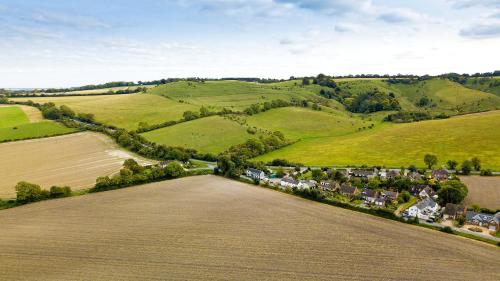 an aerial view of a village in the hills at Aspen, Country Chalet located In Pegsdon in Hexton