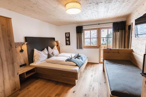 Posteľ alebo postele v izbe v ubytovaní Bergseegut Chalet und Apartment